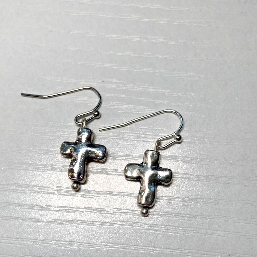 Handmade silver cross earrings.
